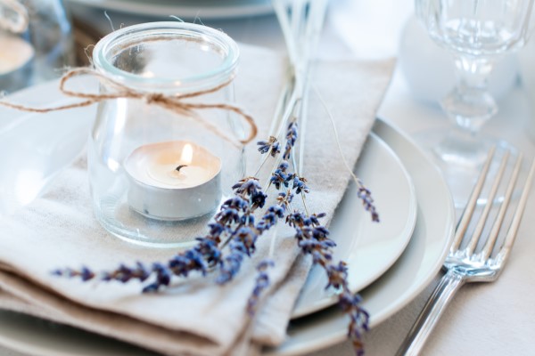 Nicely set plate and utensils with lavender and small candle