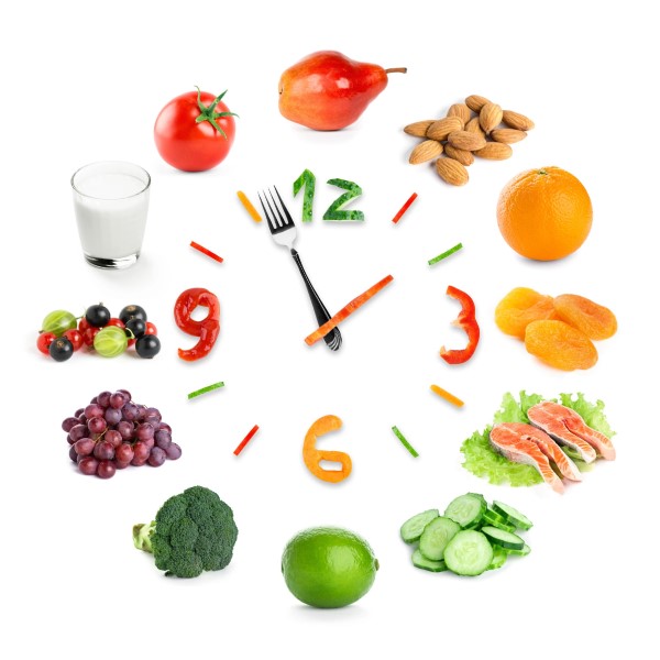 Analog clock made of various fruits, vegetables, and nuts
