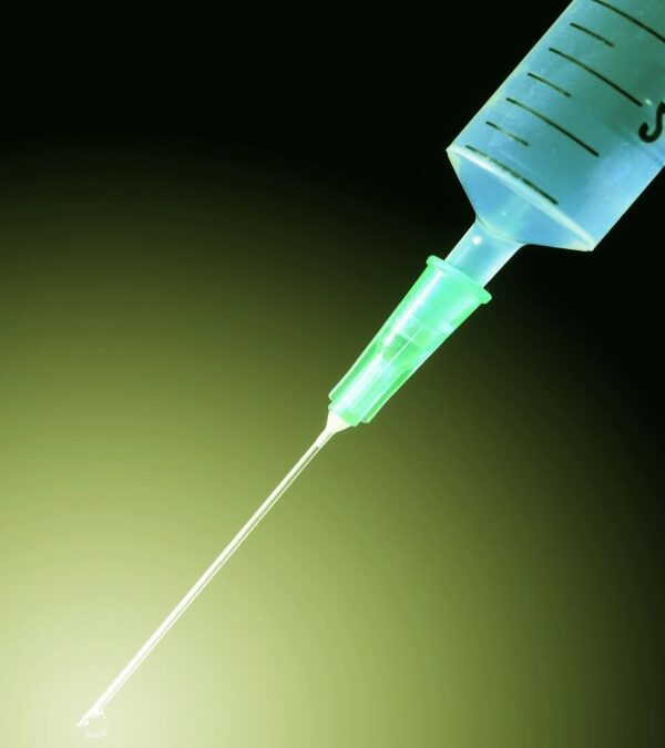 Close up of a blue syringe